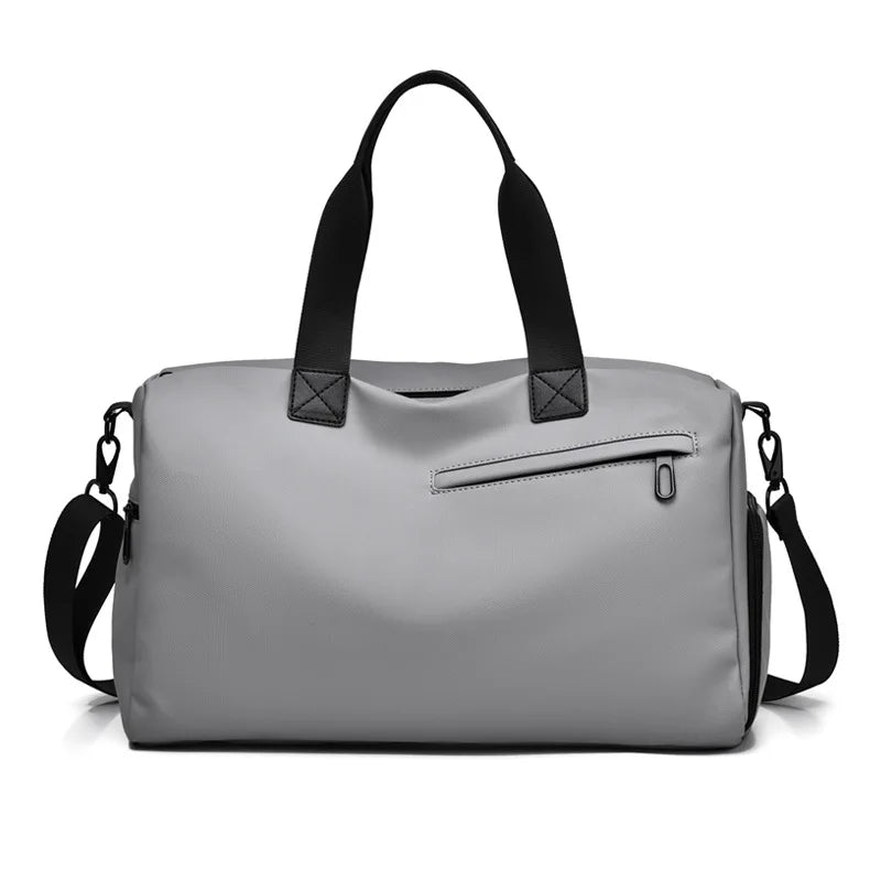 Sleek grey duffel bag with black handles and front zip pocket, modern travel carry-on